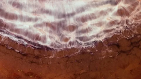 Mixing different colored alcohol inks in macro footage to show vibrant Stock Footage 347156776