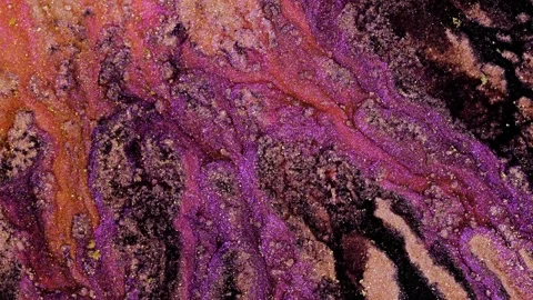 Mixing different colored alcohol inks creates vibrant patterns and textures in Stock Footage 347200403