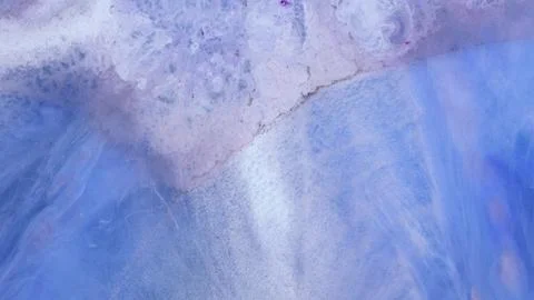 Mixing different colored alcohol inks with epoxy resin on a surface Stock Illustration