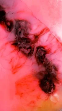 Mixing different colored alcohol inks with a close-up view of blending patterns Stock Photos