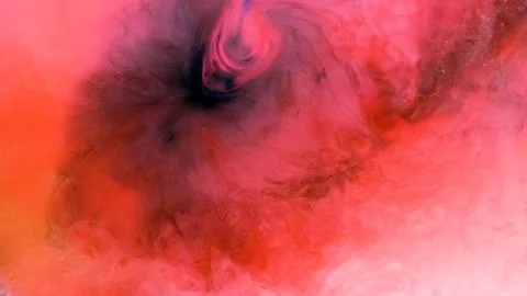 Mixing different colored alcohol inks in a close-up view Stock Photos