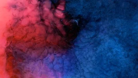 Mixing different colored alcohol inks in a close-up view Stock Photos