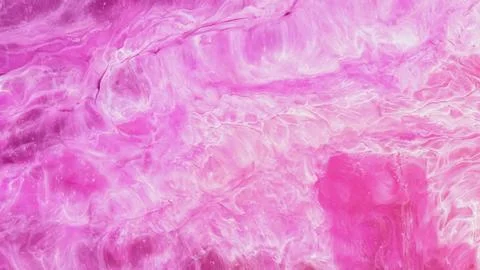 Mixing different colored alcohol inks to create unique patterns in art Stock Photos