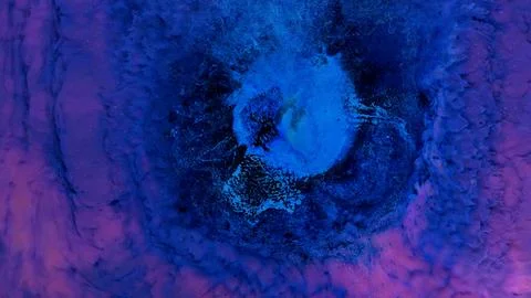 Mixing different colored alcohol inks in close-up view with vibrant patterns Stock Photos