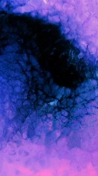 Mixing different colored alcohol inks in a creative art process Stock Photos