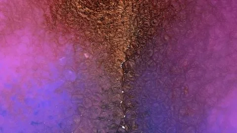 Mixing different colored alcohol inks in close-up view Stock Photos