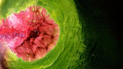 Mixing different colored alcohol inks in a close-up view Stock Photos