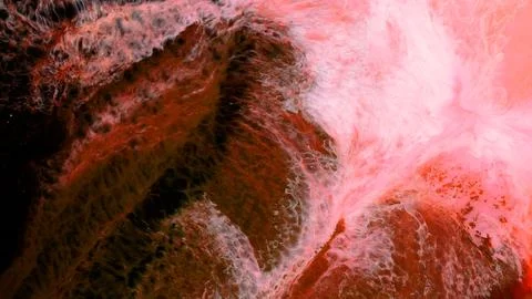 Mixing different colored alcohol inks in a close-up view Stock Photos