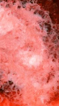 Mixing different colored alcohol inks in a close-up view Stock Photos