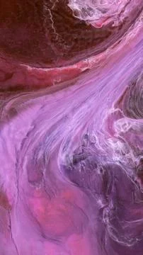 Mixing different colored alcohol inks in a close-up view of the artwork Stock Photos