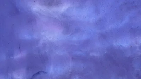 Mixing different colored alcohol inks and epoxy resin in close-up view Stock Photos