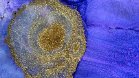Mixing different colored alcohol inks with epoxy resin in a close-up view Stock Photos