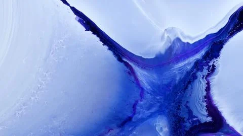 Mixing different colored alcohol inks and epoxy resin in close-up view Stock Photos