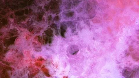 Mixing different colors of alcohol ink in a close-up view Stock Footage 342447737