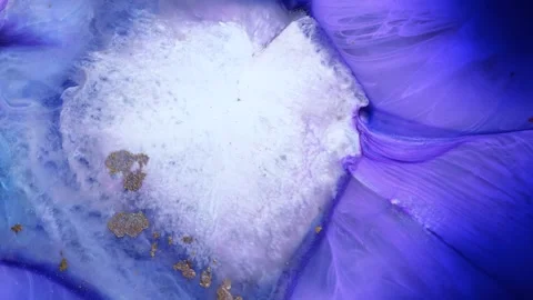 Mixing different colors of alcohol ink and epoxy resin on a surface Stock Footage 342985057