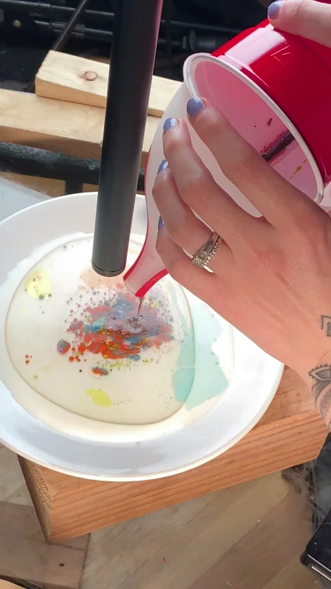 Mixing different inks and colors together with oil to create neat patterns Stock Footage 223527957