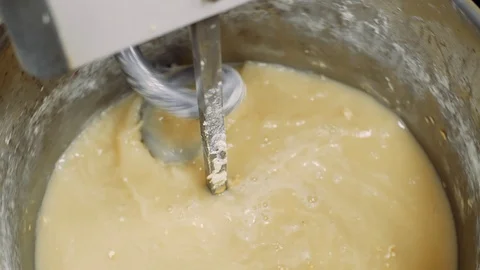Mixing a dough for bread baking with professional kneader spiral machine at the Stock Footage 103254792