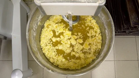 Mixing a dough for bread baking with professional kneader spiral machine at the Stock Footage 103255262