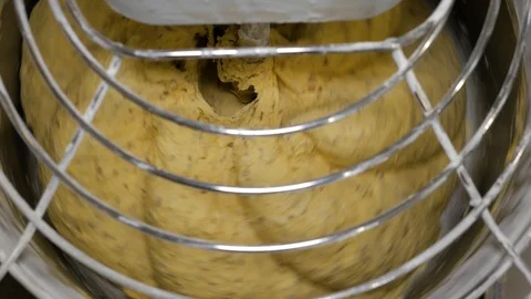 Mixing a dough for bread baking with professional kneader spiral machine Stock Footage 108632498