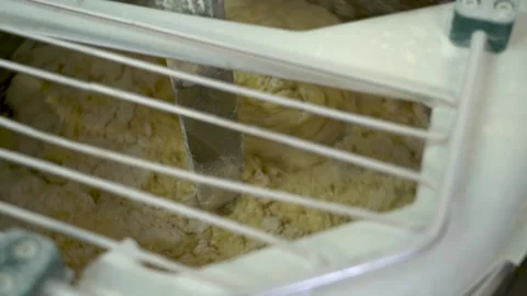 Mixing dough kneading machine at the bakery Stock Footage 220861608