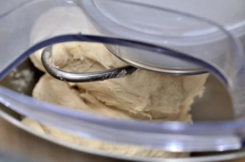 Mixing dough in multifunction machine Stock Photos
