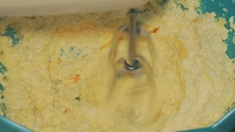 Mixing dough using hand mixer Stock Footage 315518601