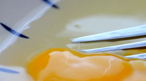 Mixing egg yolk with fork Video stock 39563838
