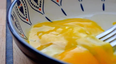 Mixing egg yolk with fork Stock Footage 39563961