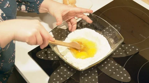 Mixing eggs and flour to prepare French pancake batter. Stock Footage 102410588
