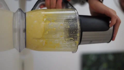 Mixing eggs in a blender vertical video Stock Footage 258202863
