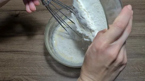 Mixing eggs with milk and flour Vídeos de archivo 164155829