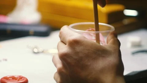 Mixing epoxy. Jewelry creating process. Stock Footage 119839351