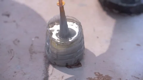 Mixing Epoxy Resin in a Plastic Cap Stock Footage 314030909