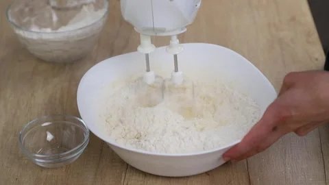 Mixing flour with dough, the process of making shortbread dough. Stock Footage 316631577