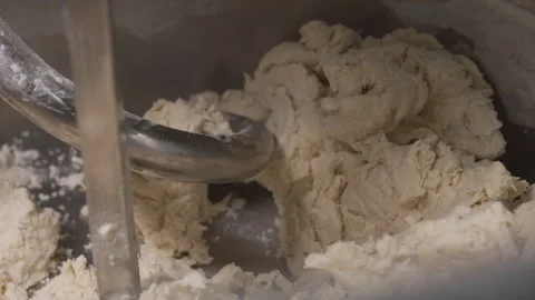 Mixing flour. The technological process of cooking. Video stock 244733255