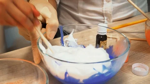 Mixing foam with dye 스톡 동영상 97657599