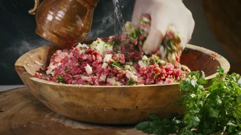 Mixing forcemeat and adding water Video stock 138126482