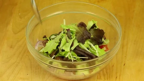Mixing fresh salad Stock Footage 83374342