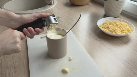 Mixing Garlic Sauce In Cup Preparing Flavorful Dressing Cooking Process Close Video stock 336447670