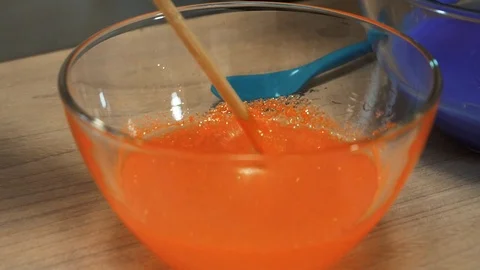 Mixing of glue with dye 스톡 동영상 97657378