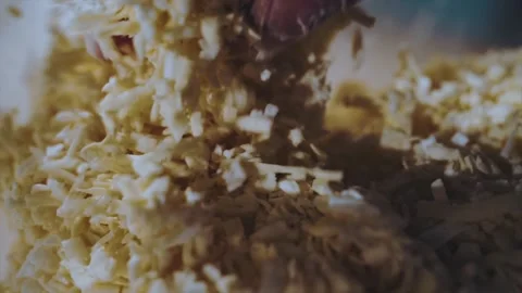 Mixing grated cheese with gloved hands Stock Footage 151591182