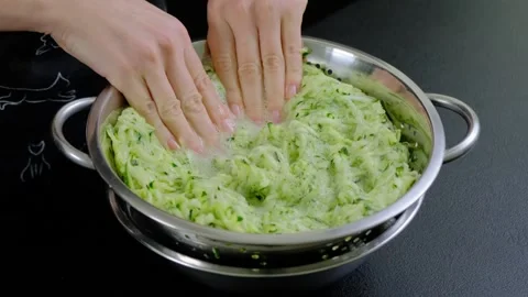 Mixing Grated Zucchini in Pot During Cooking Preparation Stock Footage 341439924