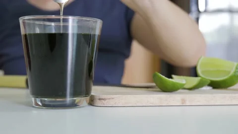 Mixing green tea with lime and honey. Stock Footage 154091823