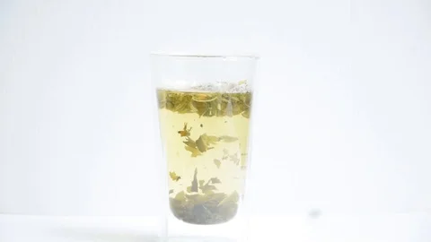 Mixing green tea with spoon Stock Footage 129767747