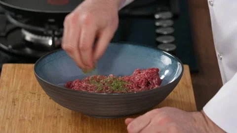 Mixing ground beef with spices Stock Footage 183568277