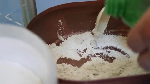 Mixing grout poder with water Stock Footage