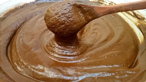Mixing Henna Paste with Wooden Spoon, Fresh Henna Paste for Hair and Mehndi Stock Footage 338233128