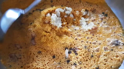 Mixing Hot Oil with Mustard Split and Spices for Traditional Pickle Preparation Video stock 337469050