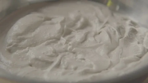 Mixing Hummus in slowmotion Stock Footage 84059508