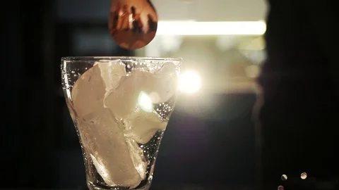 Mixing ice in a glass Stock Footage 106749009